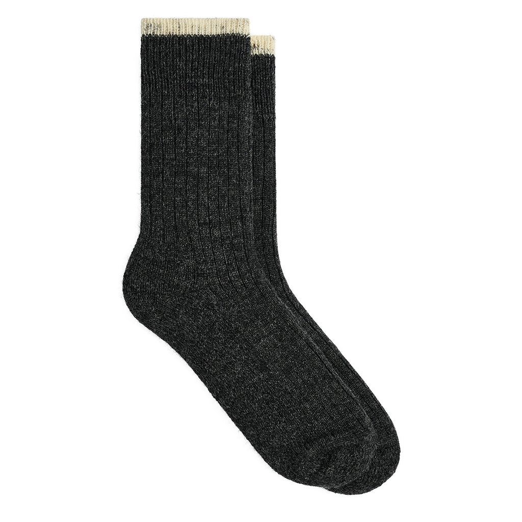 A single black ribbed crew sock with a small embroidered letter 'C' logo on the upper cuff, displayed against a clean white background.