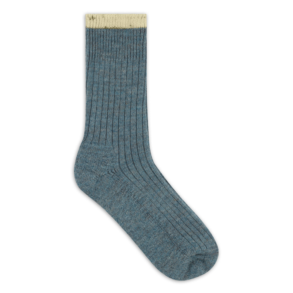 Blue sock with a white cuff on a white background