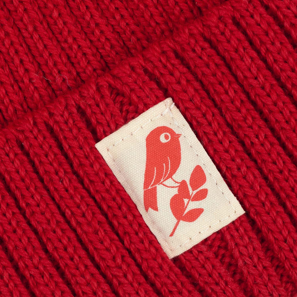 Matt Sewell + Silverstick merino wool red bird beanie label