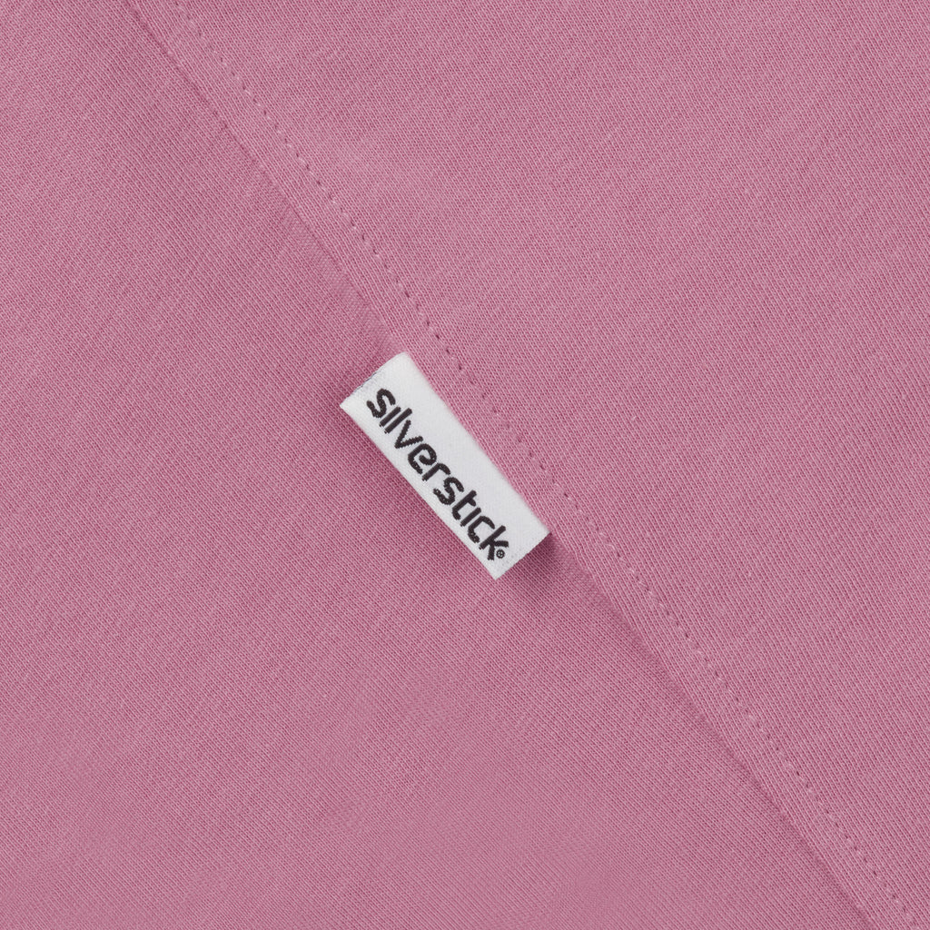 Close-up of a 'Silverstick' label on a pink fabric background