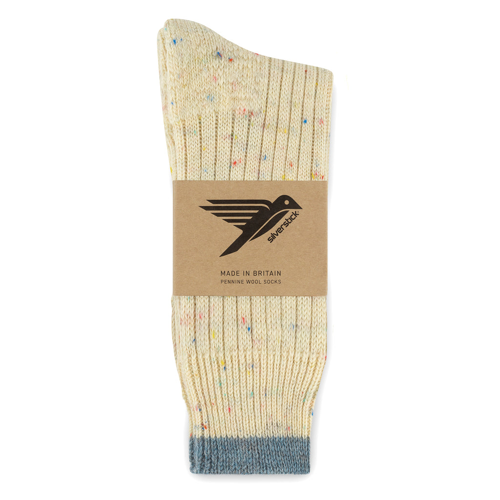 Beige sock with speckles and gray toe, displayed on a white background with a brand label.